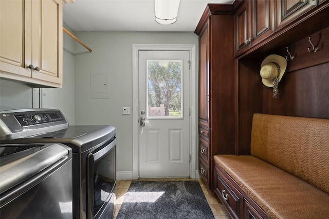 17700 N Rim Dr, Leander, TX 78641 - laundry area featuring cabinet space, washer and clothes dryer, electric panel, and light tile patterned floors