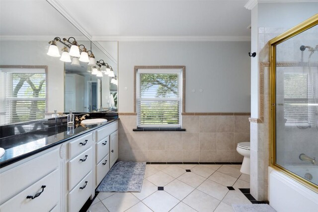 17700 N Rim Dr, Leander, TX 78641 - full bathroom with tile walls, vanity, crown molding, tile patterned flooring, and a wainscoted wall