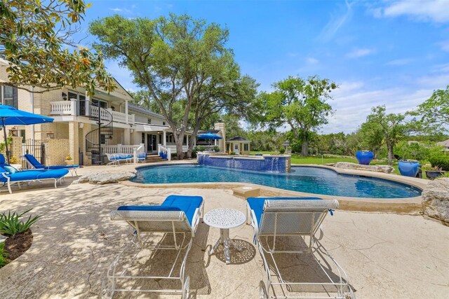 outdoor pool featuring a patio