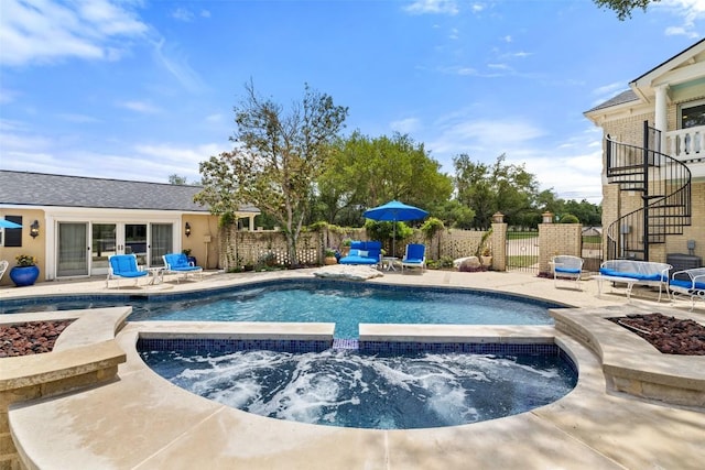 view of pool featuring an outdoor fire pit, stairway, and fence