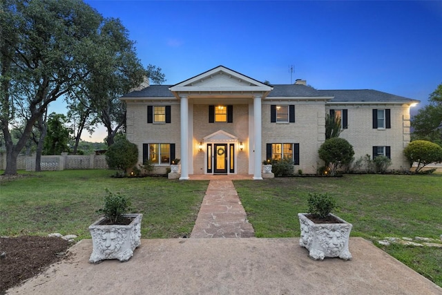 17700 N Rim Dr, Leander, TX 78641 - neoclassical / greek revival house featuring a chimney and brick siding