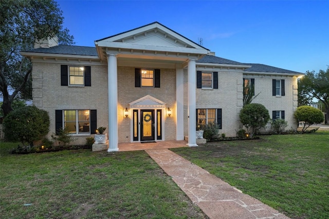 17700 N Rim Dr, Leander, TX 78641 - greek revival inspired property with brick siding, a front yard, and a chimney