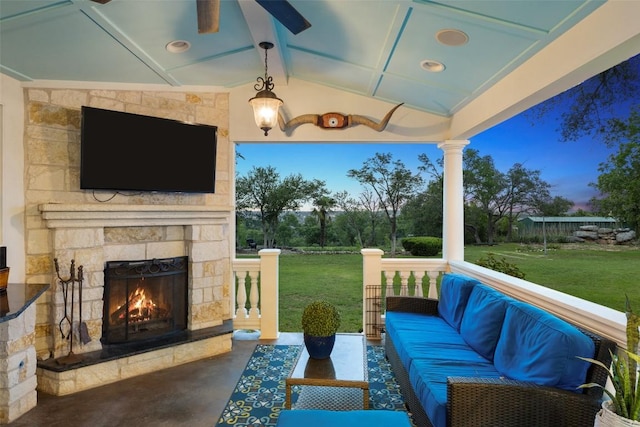 view of patio featuring an outdoor living space with a fireplace