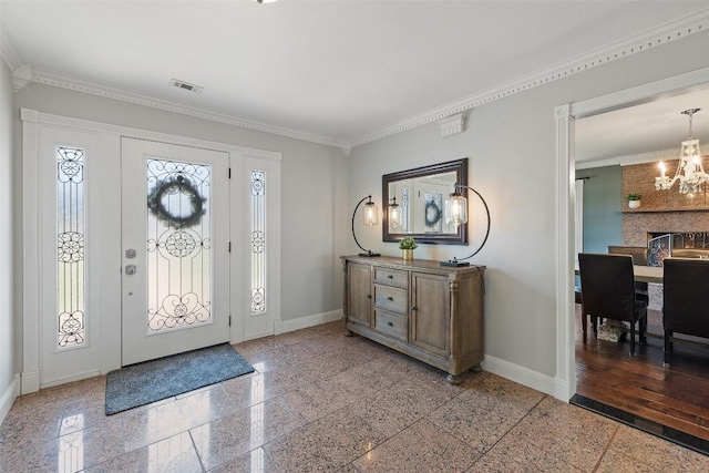 17700 N Rim Dr, Leander, TX 78641 - foyer featuring granite tiled floors, a chandelier, and crown molding