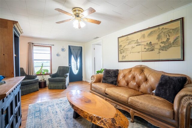 1705 Old Thorndale Rd, Taylor, TX 76574 - living room featuring ornamental molding, wood finished floors, and a ceiling fan