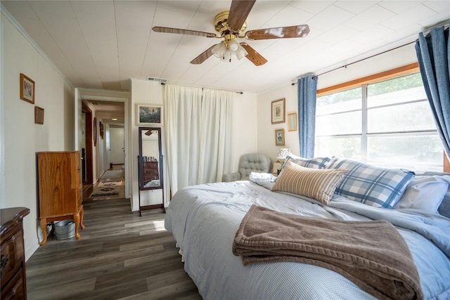 1705 Old Thorndale Rd, Taylor, TX 76574 - bedroom with wood finished floors, a ceiling fan, and ornamental molding