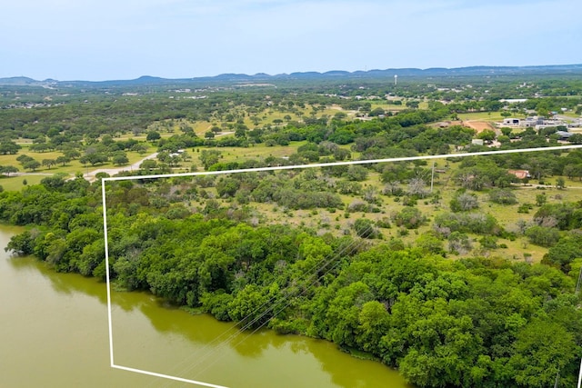 624 N US Highway 281, Johnson City, TX 78636 - aerial view of property and surrounding area featuring property parcel outlined and a water and mountain view