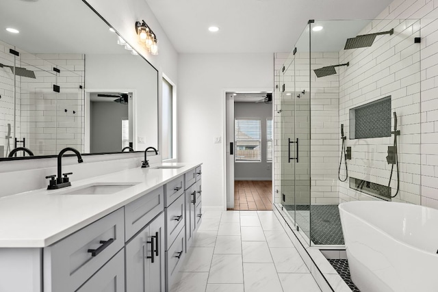 1100 Whipple Tree Trl, Georgetown, TX 78626 - bathroom featuring a stall shower, marble finish floors, double vanity, a soaking tub, and ceiling fan