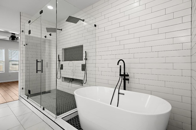 1100 Whipple Tree Trl, Georgetown, TX 78626 - bathroom featuring a stall shower, a freestanding bath, tile walls, recessed lighting, and a ceiling fan