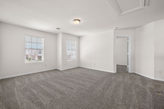 1100 Whipple Tree Trl, Georgetown, TX 78626 - empty room featuring carpet, baseboards, a textured ceiling, and attic access