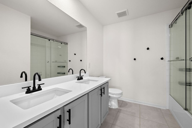 1100 Whipple Tree Trl, Georgetown, TX 78626 - bathroom with toilet, tile patterned floors, double vanity, and baseboards
