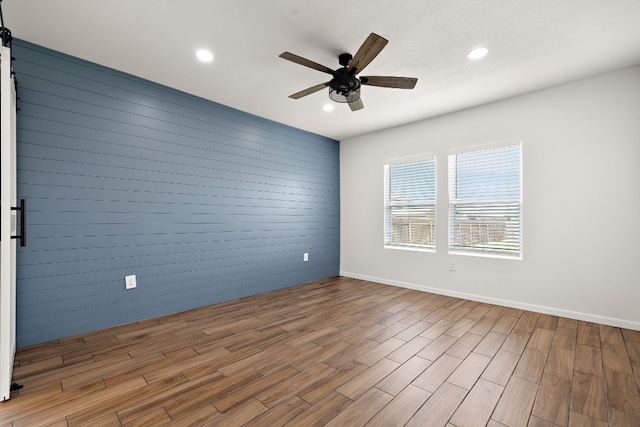 1100 Whipple Tree Trl, Georgetown, TX 78626 - empty room with a ceiling fan, wood finished floors, recessed lighting, and baseboards