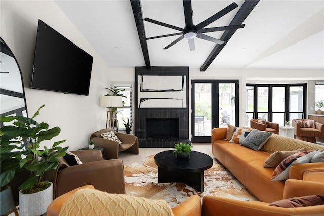 2209 Forest Bend Dr, Austin, TX 78704 - living area with ceiling fan, a tile fireplace, and wood finished floors