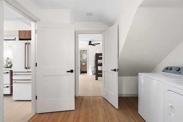 2209 Forest Bend Dr, Austin, TX 78704 - laundry room featuring washing machine and clothes dryer, a ceiling fan, and light wood-style floors