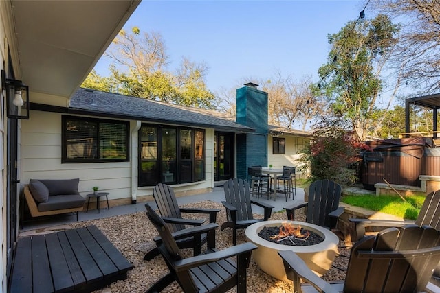 2209 Forest Bend Dr, Austin, TX 78704 - rear view of property with a fire pit, a patio, a chimney, roof with shingles, and outdoor dining area