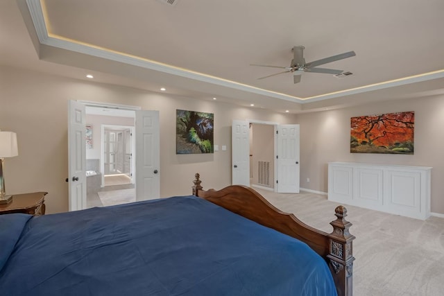 bedroom featuring a tray ceiling, light carpet, recessed lighting, baseboards, and a ceiling fan