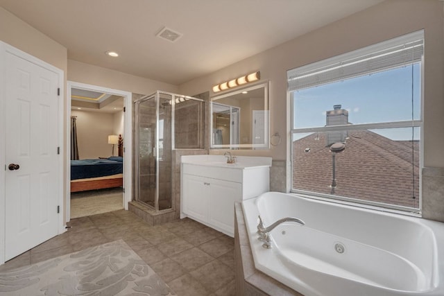 ensuite bathroom featuring a stall shower, vanity, a bath, recessed lighting, and tile patterned floors