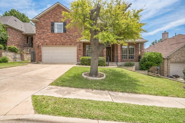 traditional-style home with brick siding, concrete driveway, an attached garage, and a front yard