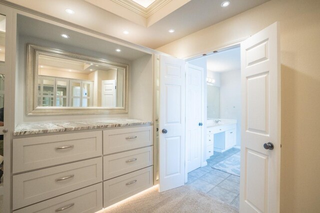 bathroom featuring recessed lighting, vanity, and ornamental molding