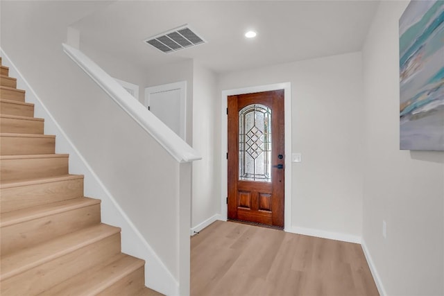 8921 Norwich Castle, Austin, TX 78747 - foyer entrance featuring stairway, wood finished floors, baseboards, and recessed lighting
