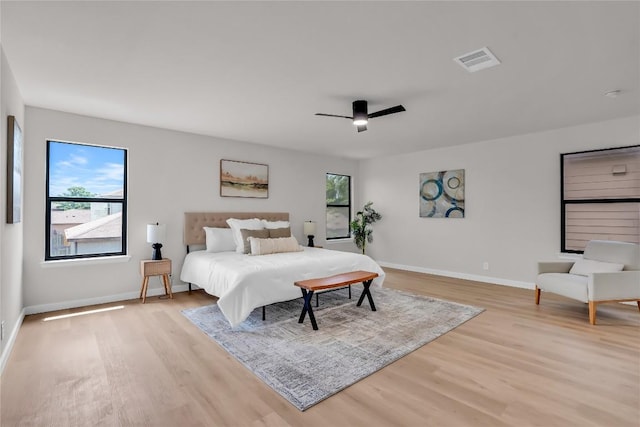 8921 Norwich Castle, Austin, TX 78747 - bedroom featuring light wood-style flooring, baseboards, and a ceiling fan