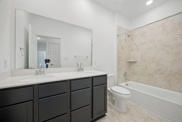 full bath with double vanity, toilet, and shower / bath combination