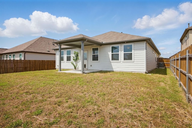 rear view of property with a patio area and central AC unit