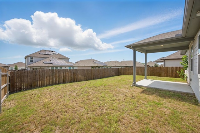 view of yard featuring a patio area and a residential view