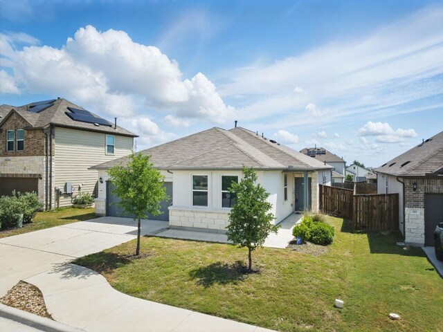 209 Thurman Holt Rd, Hutto, TX 78634 - view of front of home with concrete driveway, an attached garage, stucco siding, and roof with shingles