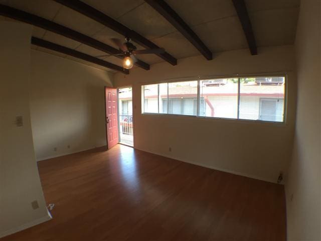 2404 Longview St Unit 205, Austin, TX 78705 - empty room featuring ceiling fan, wood finished floors, and baseboards
