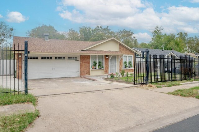 9801 Oriole Dr, Austin, TX 78753 - ranch-style home featuring an attached garage, concrete driveway, roof with shingles, and brick siding