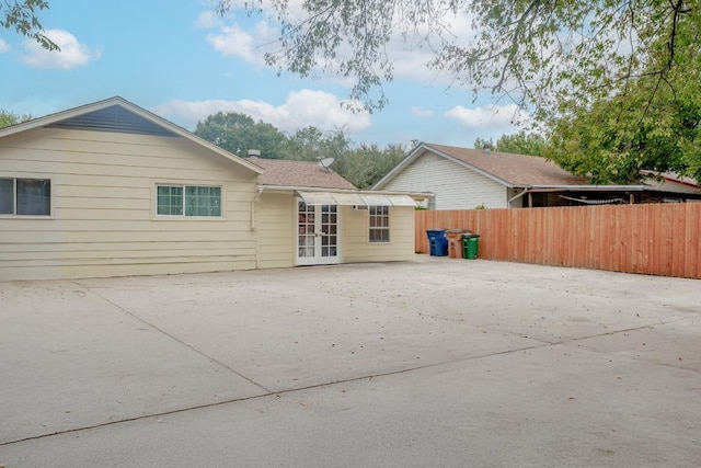 9801 Oriole Dr, Austin, TX 78753 - back of property with a patio area, french doors, and driveway
