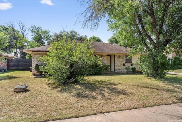 7008 Beckett Rd, Austin, TX 78749 - view of front of house featuring stone siding and a shingled roof