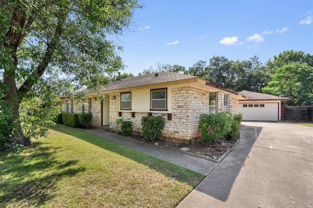 7008 Beckett Rd, Austin, TX 78749 - ranch-style home with concrete driveway, a garage, a front yard, stone siding, and roof with shingles