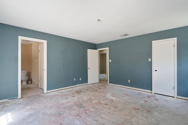 7008 Beckett Rd, Austin, TX 78749 - unfurnished bedroom featuring baseboards and ensuite bath
