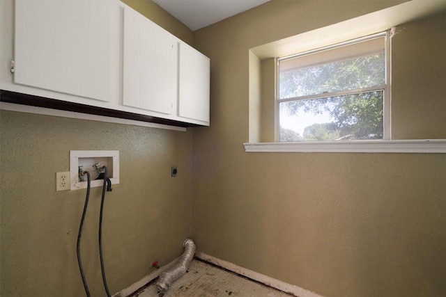 7008 Beckett Rd, Austin, TX 78749 - washroom featuring cabinet space, hookup for a washing machine, baseboards, and electric dryer hookup