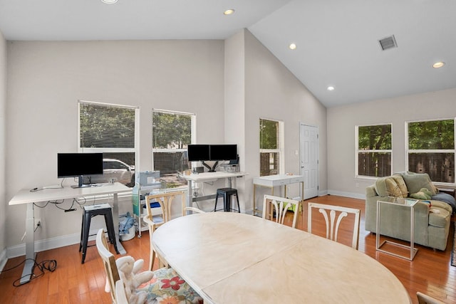 716 W 35th St, Austin, TX 78705 - dining space with a desk, healthy amount of natural light, high vaulted ceiling, wood finished floors, and recessed lighting