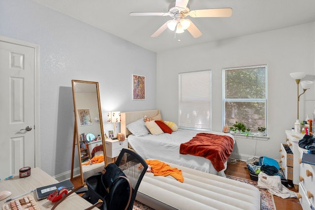 716 W 35th St, Austin, TX 78705 - bedroom with wood finished floors and ceiling fan