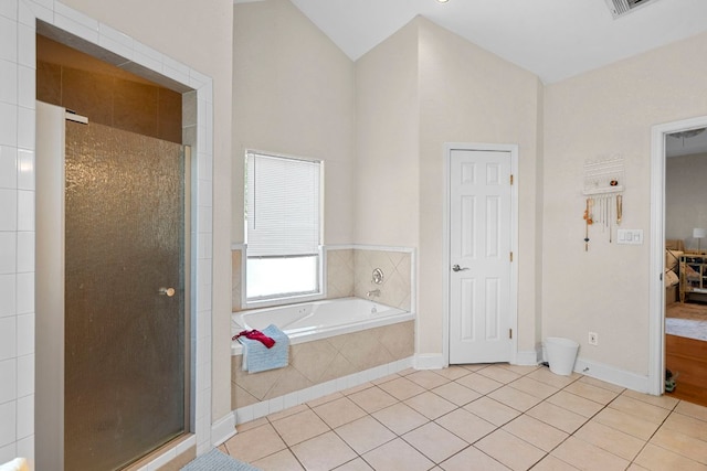 716 W 35th St, Austin, TX 78705 - bathroom with a shower stall, a garden tub, and tile patterned floors