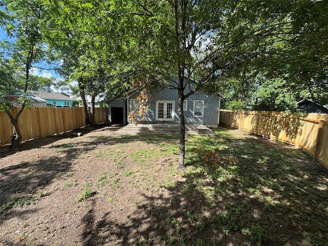 716 W 35th St, Austin, TX 78705 - fenced backyard featuring french doors