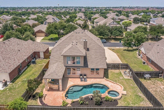 18701 Jana Patrice Dr, Pflugerville, TX 78660 - view of swimming pool with a fenced backyard, a residential view, a pool with connected hot tub, cooling unit, and a patio area