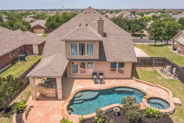 18701 Jana Patrice Dr, Pflugerville, TX 78660 - view of swimming pool with central air condition unit, a patio area, and a pool with connected hot tub