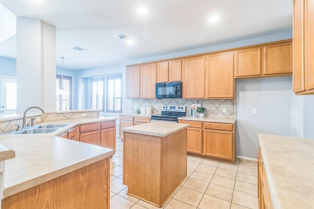 kitchen with black microwave, stainless steel electric stove, a sink, a center island, and backsplash