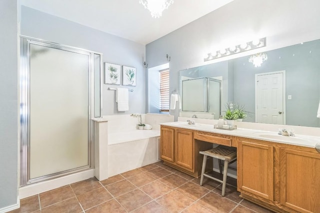 bathroom featuring a stall shower, double vanity, a bath, and tile patterned floors