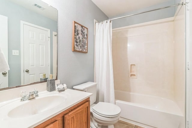 full bath with toilet, shower / bath combo with shower curtain, vanity, and tile patterned floors