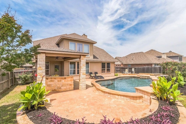 view of swimming pool featuring ceiling fan, a fenced backyard, and a patio