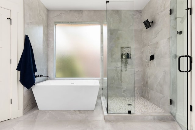 6909 Larue Belle Cv, Austin, TX 78739 - full bath featuring a stall shower, a freestanding bath, and marble finish floors