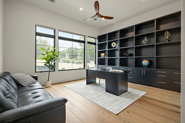 office featuring a ceiling fan, light wood-style flooring, and recessed lighting