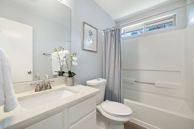 bathroom featuring toilet, vanity, and shower / bath combination with curtain