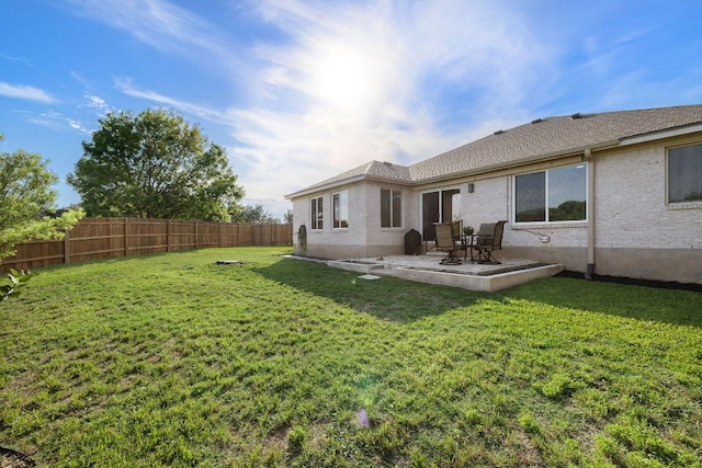 rear view of property featuring a patio area